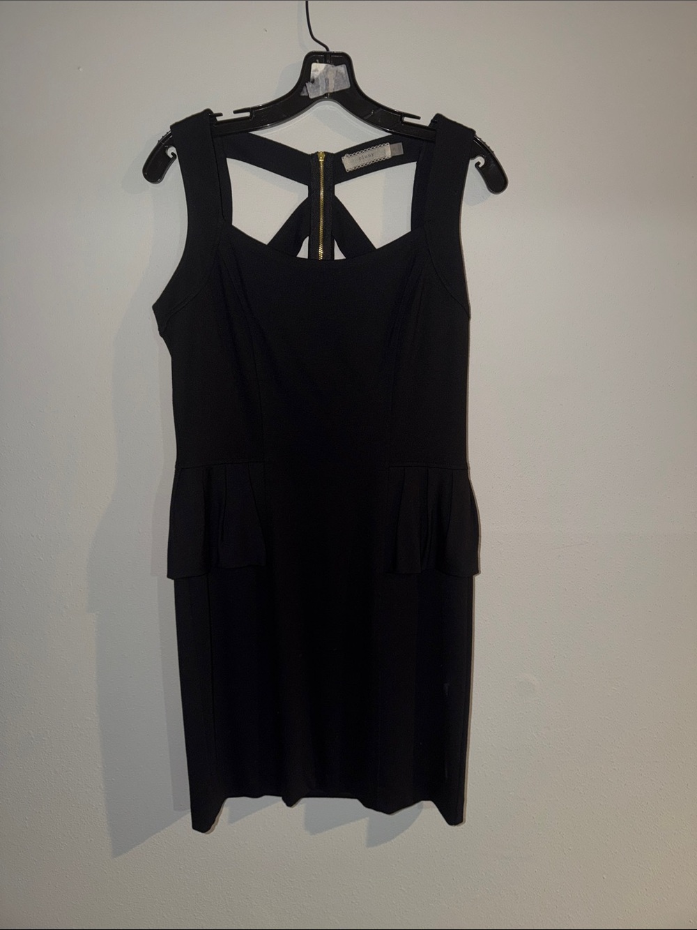 Women's Black Sleeveless Peplum Mini Dress with Strappy Back